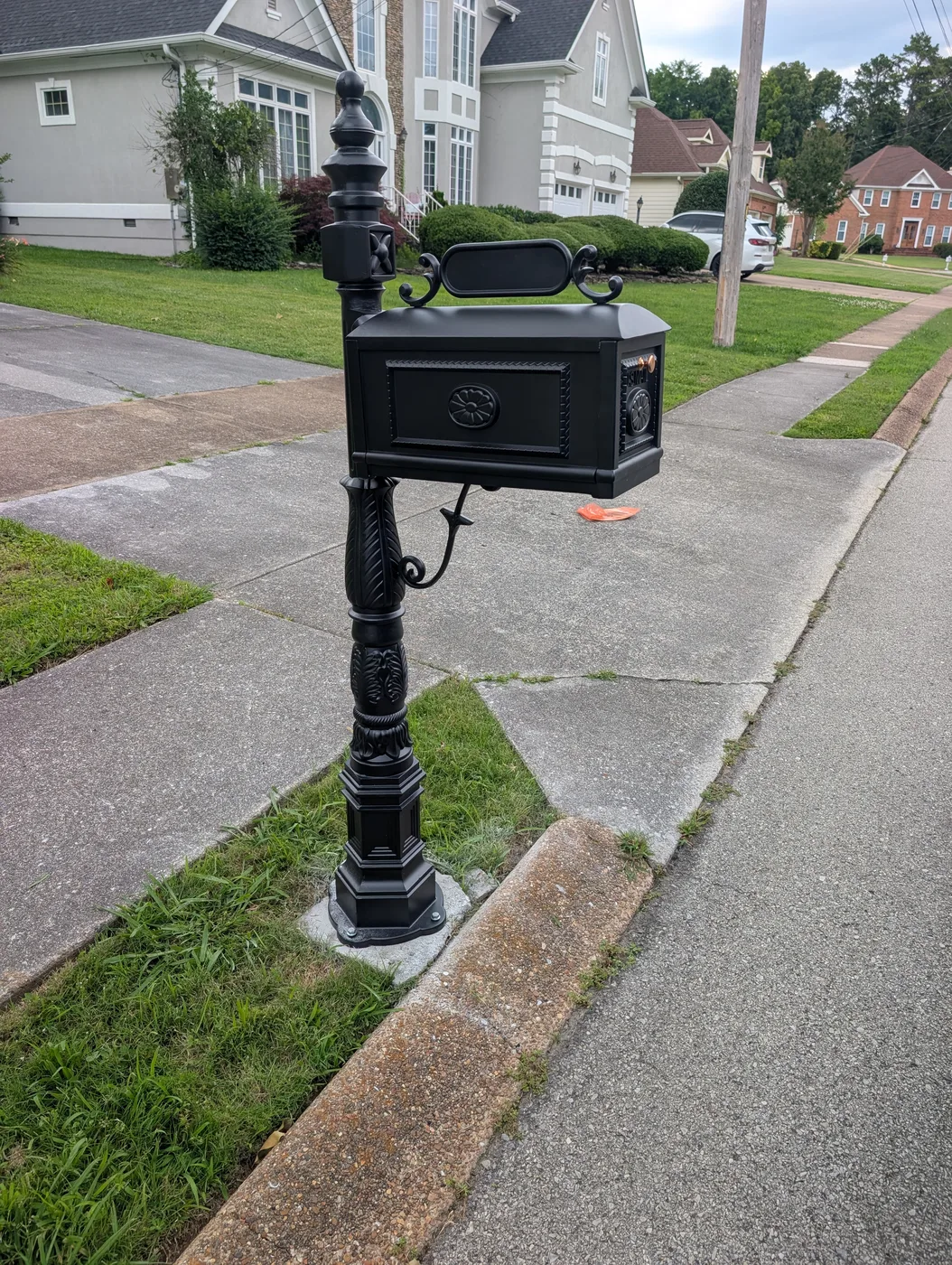 Black curbside mailbox and post from a Frye Inc. installation project